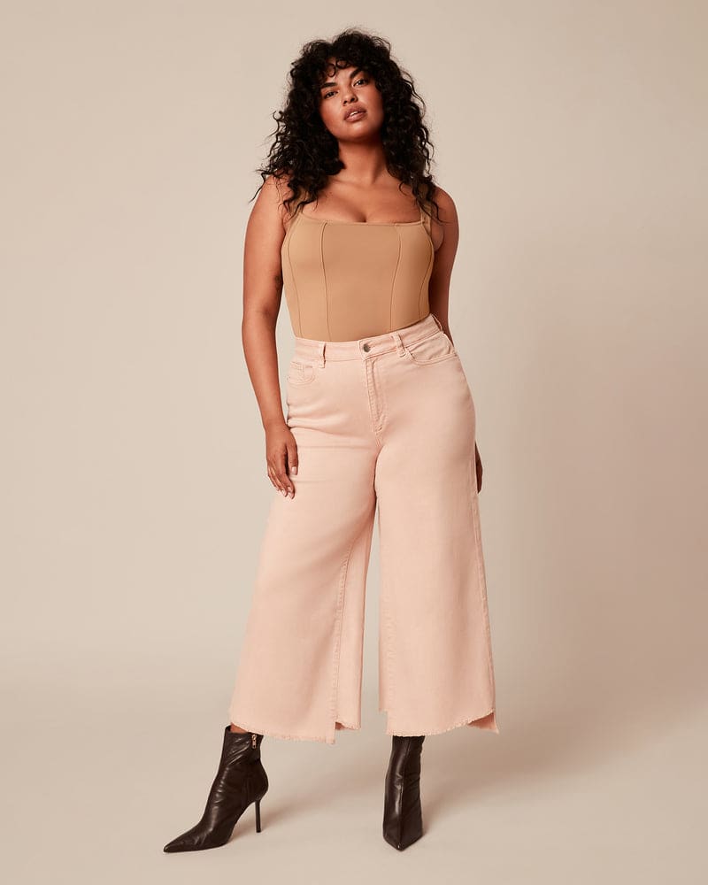 Front of a model wearing a size 4 Scuba Corset Bodysuit in Brown by Good American. | dia_product_style_image_id:235439